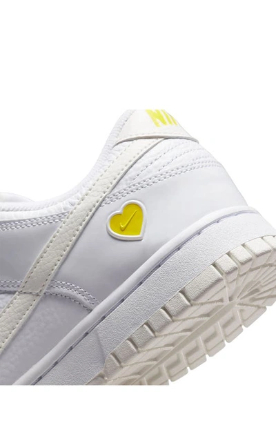 Shop Nike Dunk Low Basketball Shoe In White/ Sail/ Opti Yellow