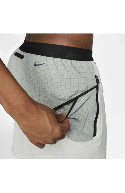 Shop Nike Dri-fit Trail Running Shorts In Silver/ Green/ Black