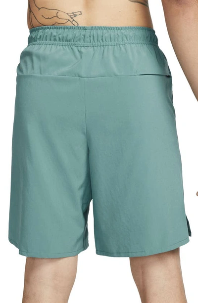 Shop Nike Dri-fit Unlimited Training Shorts In Mineral Teal/ Black