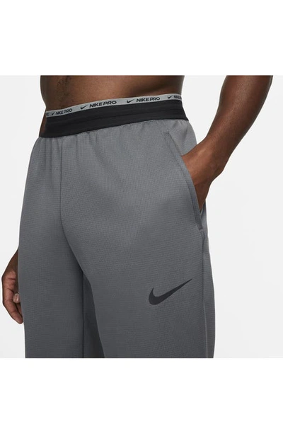 Shop Nike Pro Therma-fit Joggers In Iron Grey/ Black/ Black