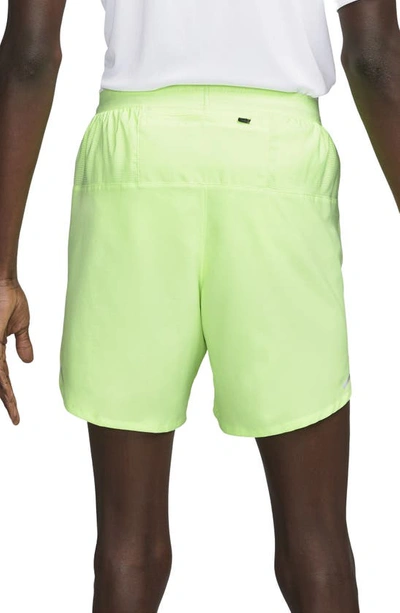 Shop Nike Dri-fit Stride 7-inch Brief-lined Running Shorts In Ghost Green/midnight Navy