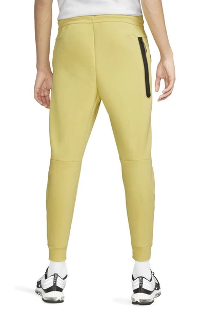 Shop Nike Tech Fleece Jogger Sweatpants In Saturn Gold/ Black