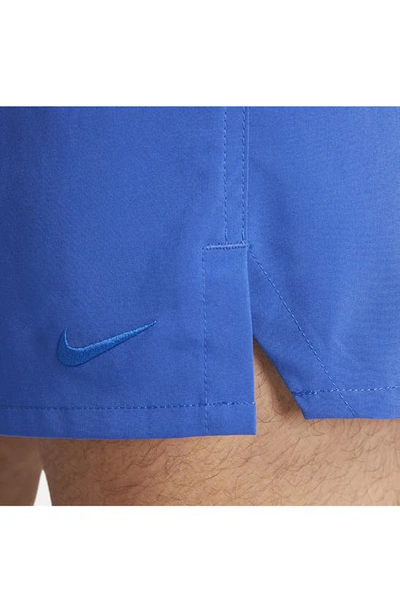 Shop Nike Dri-fit Unlimited 7-inch Unlined Athletic Shorts In Game Royal/ Black/ Game Royal