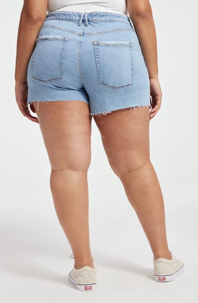 Shop Good American Bombshell Cutoff Denim Shorts In Indigo430