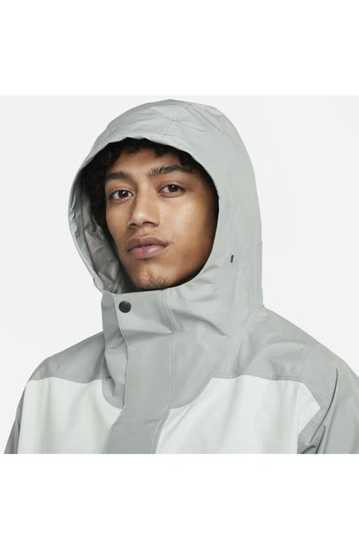 Shop Nike Sportswear Storm-fit Adv Anorak In Mica Green/ Light Silver