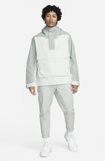 Shop Nike Sportswear Storm-fit Adv Anorak In Mica Green/ Light Silver
