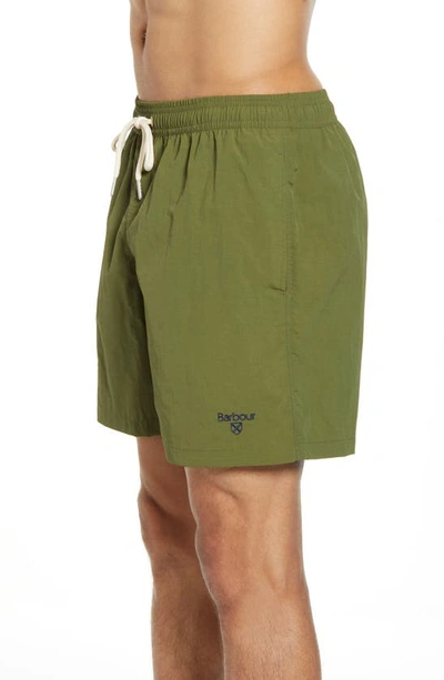 Shop Barbour Essential Solid Nylon Swim Trunks In Olive