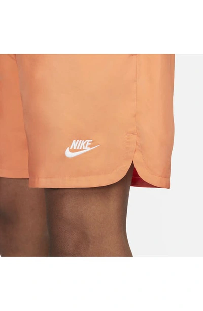 Shop Nike Woven Lined Flow Shorts In Orange Trance/white