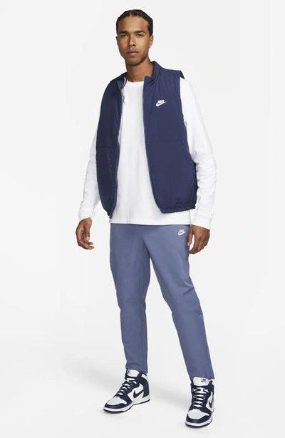 Shop Nike Woven Tapered Leg Pants In Diffused Blue/ White