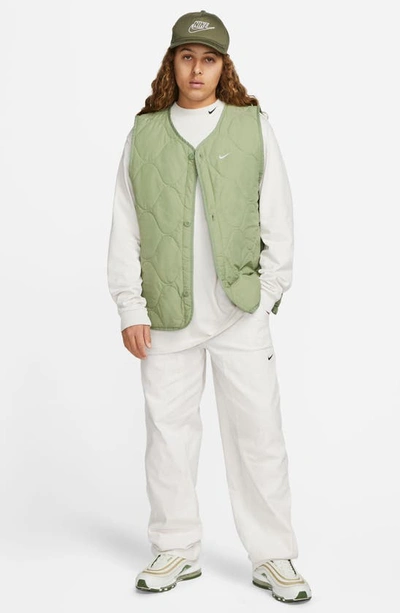 Shop Nike Woven Insulated Military Vest In Oil Green/ White