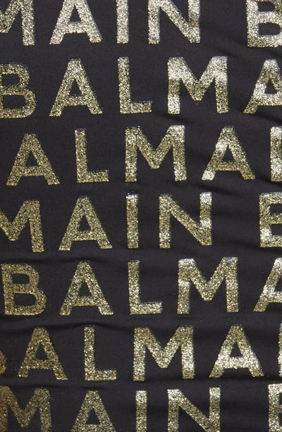 Shop Balmain Glitter Logo One-shoulder One-piece Swimsuit In Black/ Gold