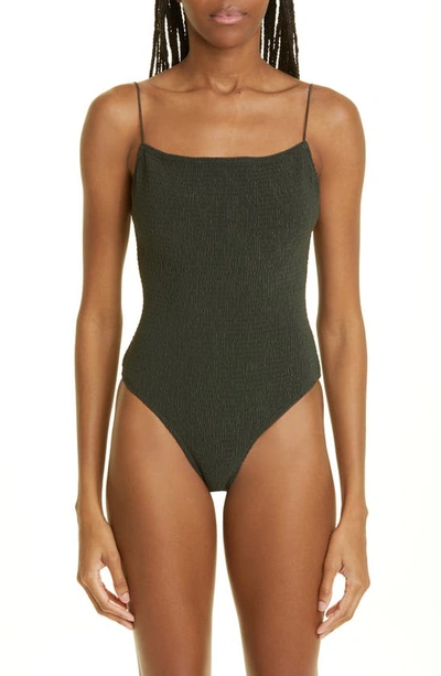 Shop Totême Smocked One-piece Swimsuit In Dark Green