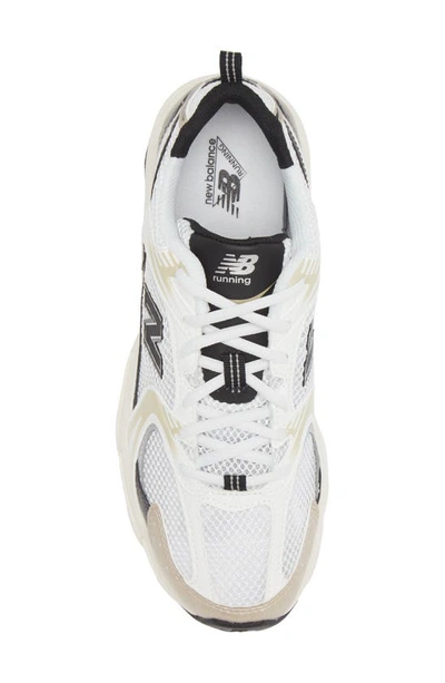 Shop New Balance Gender Inclusive 530 Sneaker In White/ Light Gold Metallic