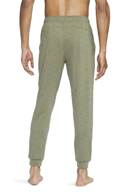 Shop Nike Pocket Yoga Pants In Olive/ Cargo Khaki/ Black