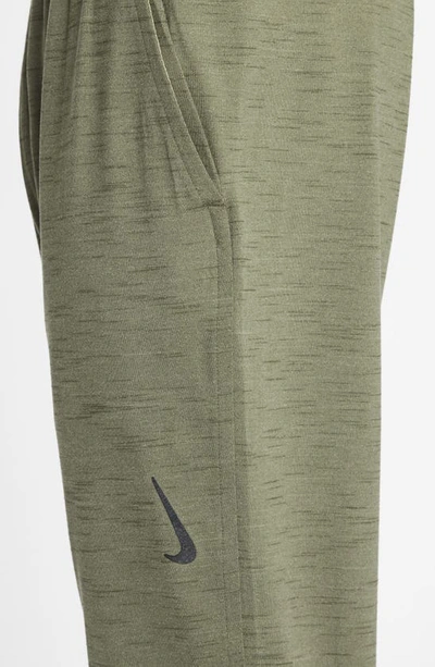 Shop Nike Pocket Yoga Pants In Olive/ Cargo Khaki/ Black
