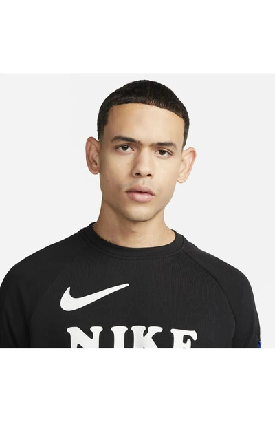 Shop Nike Dri-fit Moving Co. Long Sleeve Graphic Tee In Black