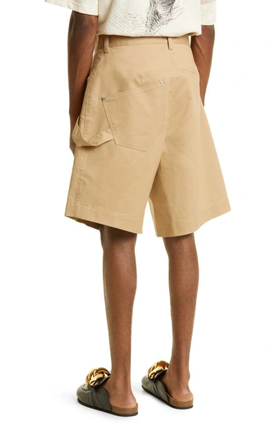Shop Jw Anderson Twisted Chino Shorts In Beige