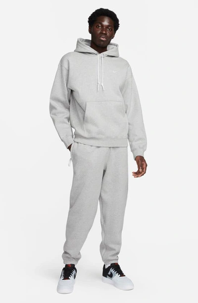 Shop Nike Solo Swoosh Fleece Hoodie In Dark Grey Heather/ White