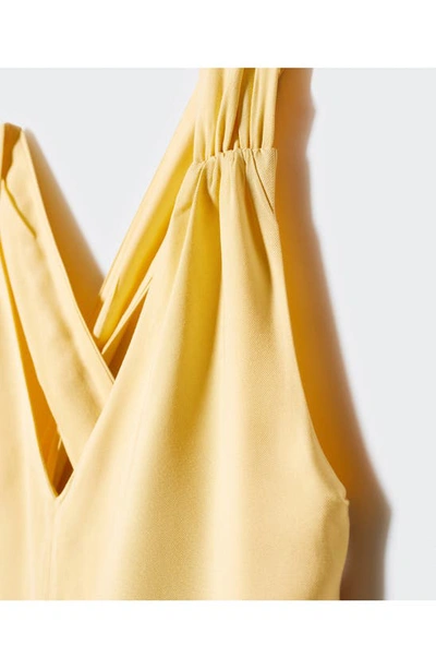 Shop Mango Cross Back Strap Crop Jumpsuit In Pastel Yellow
