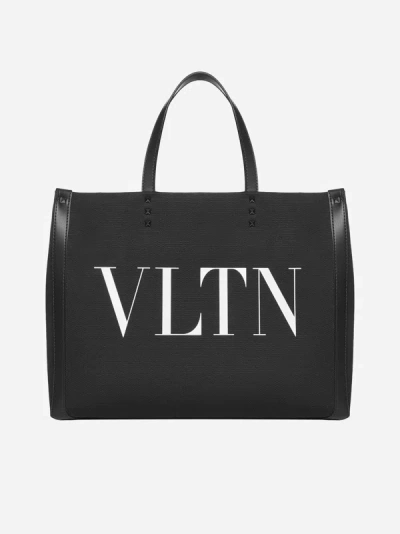 Shop Valentino Vltn Canvas Tote Bag In Black,white