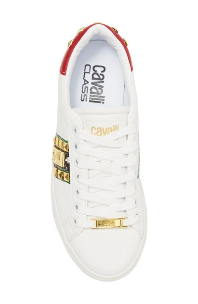 Shop Roberto Cavalli Snake Embossed Pyramid Stud Tennis Shoe In White
