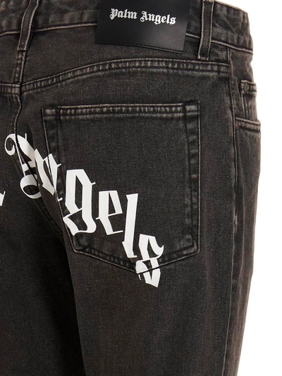 Shop Palm Angels Jeans 'curved Logo'