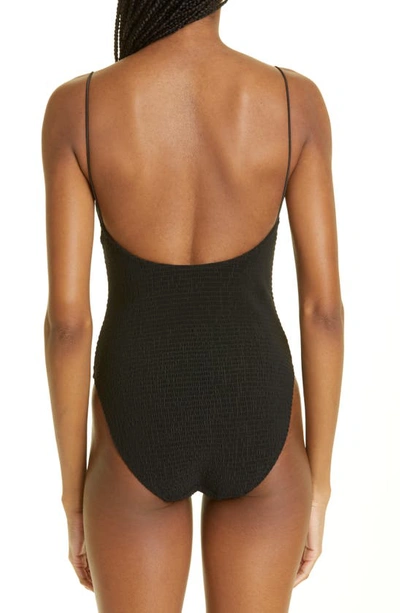 Shop Totême Smocked One-piece Swimsuit In Black