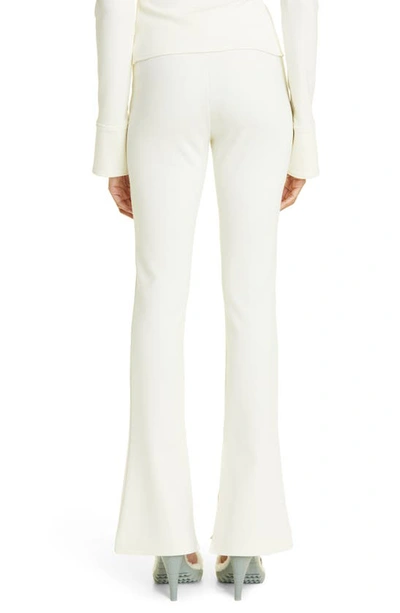 Shop Off-white Split Hem Stretch Crepe Flare Leg Leggings In White