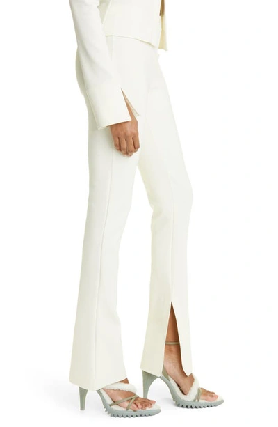 Shop Off-white Split Hem Stretch Crepe Flare Leg Leggings In White