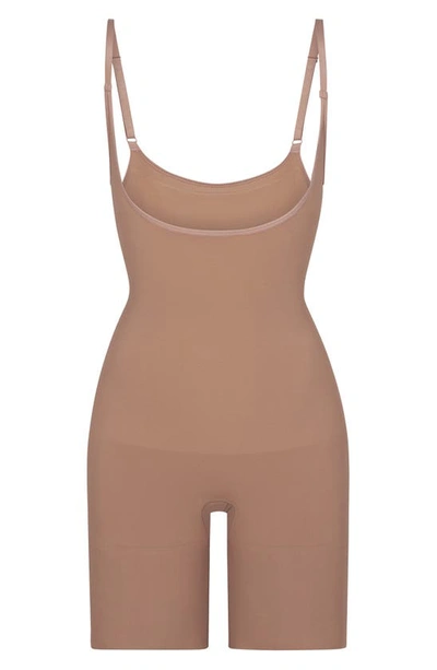 Shop Skims Butt Enhancing Open Bust Bodysuit In Sienna