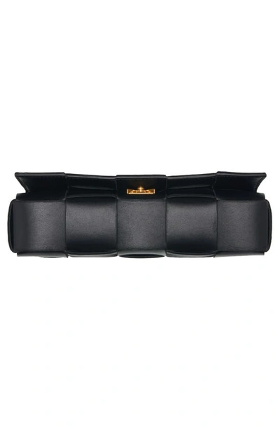 Shop Bottega Veneta Cassette Intrecciato Leather Clutch In 8425 Black-gold