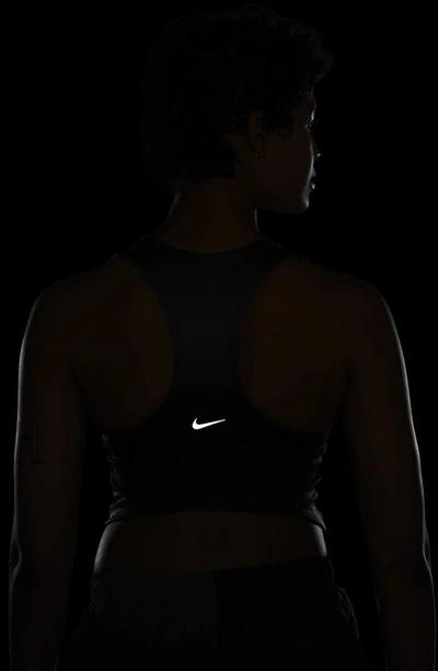 Shop Nike Dri-fit Swoosh Cropped Tank In Black