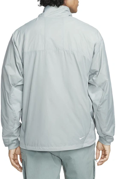 Shop Nike Acg Sierra Light Water Repellent Jacket In Green/ Silver/ Black/ White