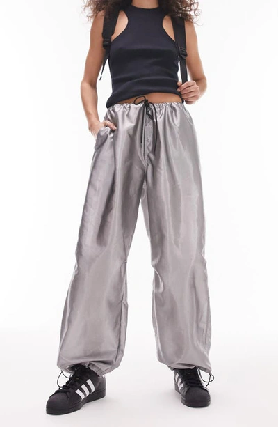 Shop Topshop Oversize Metallic Parachute Trousers In Silver