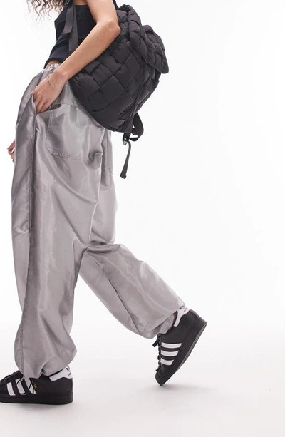 Shop Topshop Oversize Metallic Parachute Trousers In Silver