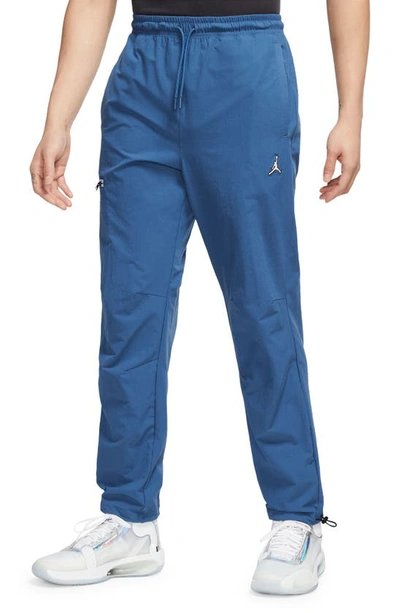 Shop Jordan Woven Stretch Nylon Pants In True Blue/ White