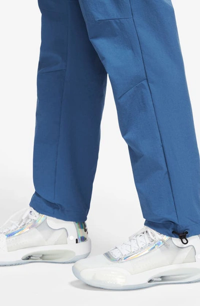 Shop Jordan Woven Stretch Nylon Pants In True Blue/ White