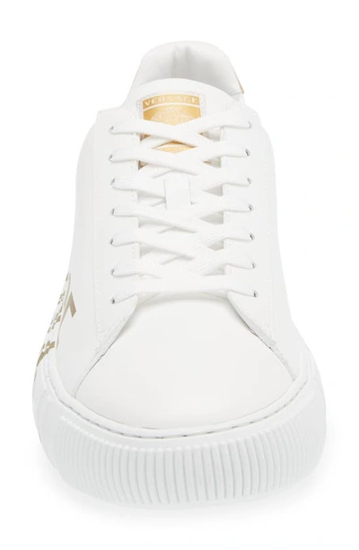 Shop Versace La Greca Logo Low Top Sneaker In White/ Gold