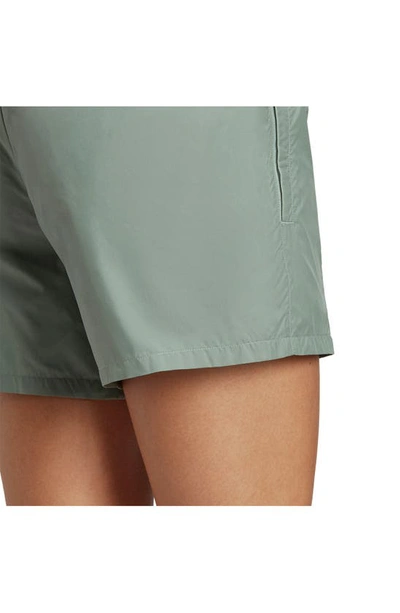 Shop Adidas Sportswear City Escape Recycled Polyester Shorts In Silver Green