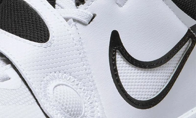 Shop Nike Kids' Team Hustle D 11 Basketball Sneaker In White/ Black