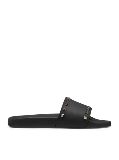 Shop Valentino Rubber Rockstud Slider Sandal In Black