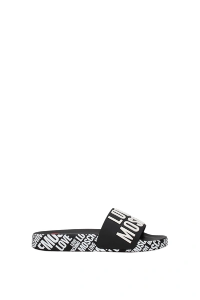 Shop Love Moschino Slippers And Clogs Pvc Black White