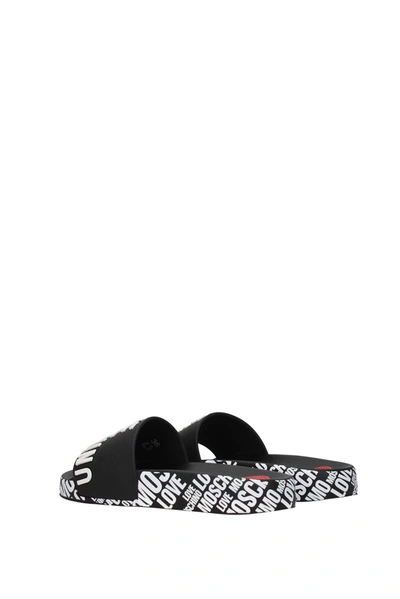 Shop Love Moschino Slippers And Clogs Pvc Black White