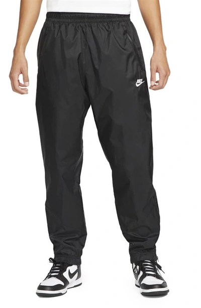 Shop Nike Windrunner Woven Lined Pants In Black/ Black/ White