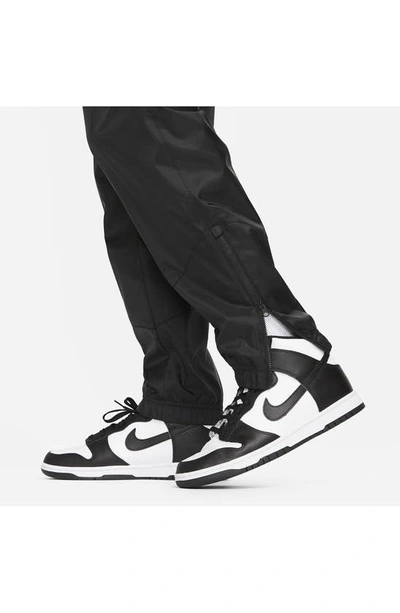 Shop Nike Windrunner Woven Lined Pants In Black/ Black/ White