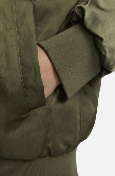 Shop Nike Sportswear Reversible Varsity Quilted Bomber Jacket In Medium Olive/ Orange/ White