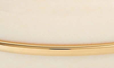 Shop Saint Laurent Resin Dome Cuff Bracelet In Gold/ Ivory
