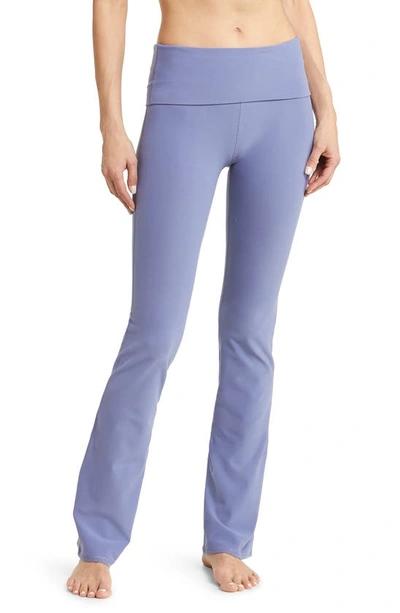 Shop Alo Yoga Foldover Waist Bootcut Alosoft Leggings In Infinity Blue