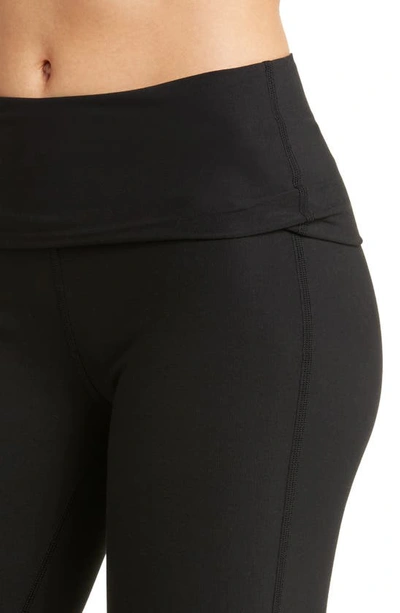 Shop Alo Yoga Foldover Waist Bootcut Alosoft Leggings In Black