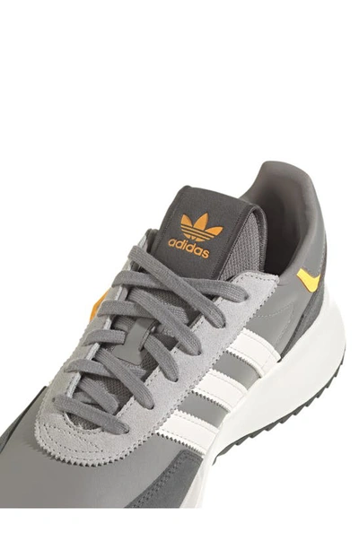 Shop Adidas Originals Retropy F2 Sneaker In Grey/ Core White/ Solar Gold